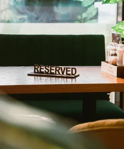 Table-service restaurant dining room representing reservations and waitlist management